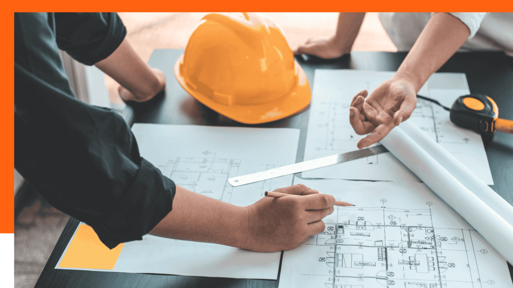 Architectes de La Compagnie des Bâtisseurs travaillant sur des plans de construction à Bruxelles