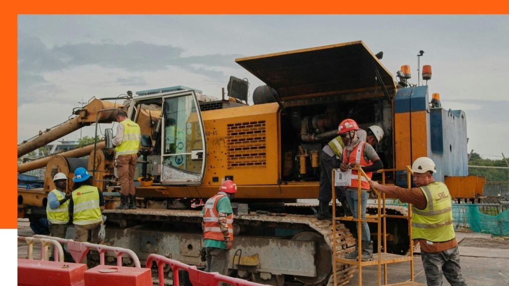 Équipe de chantier utilisant des machines de construction à Bruxelles – La Compagnie des Bâtisseurs